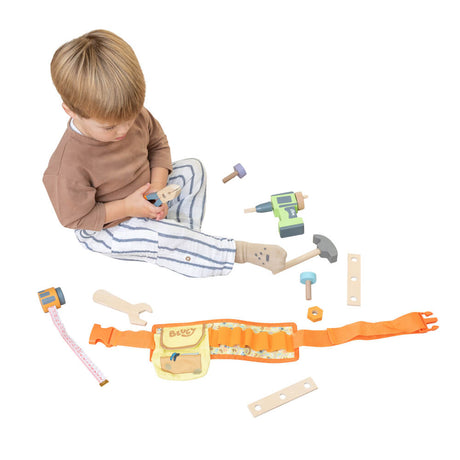 Child playing with the Bluey Tradies Belt and wooden tools